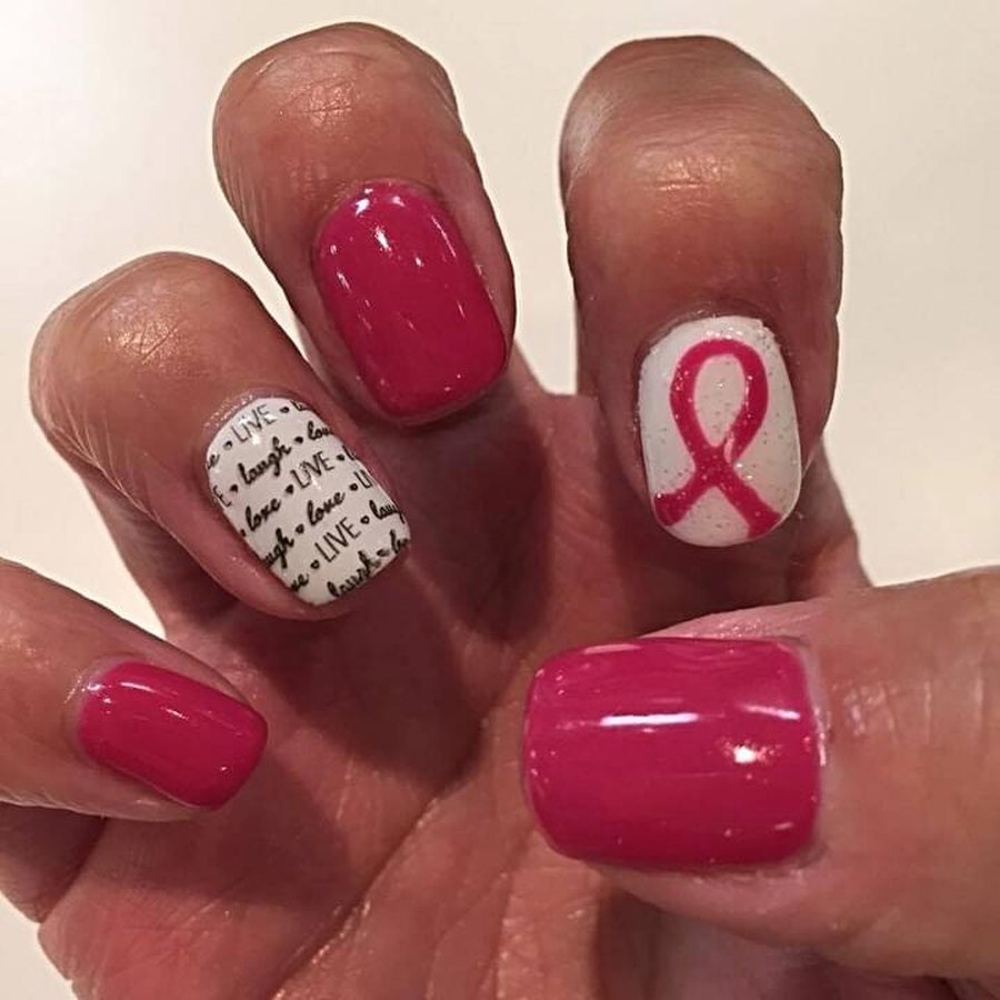 Pink breast cancer awareness ribbon accent nails on a gel manicure in Oklahoma City