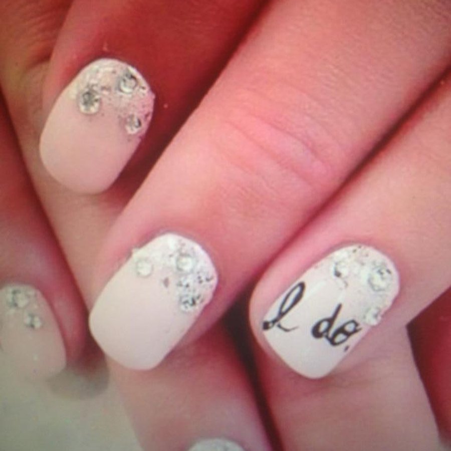 White bridal builder gel manicure with hand-lettered accent nail for an Oklahoma City wedding