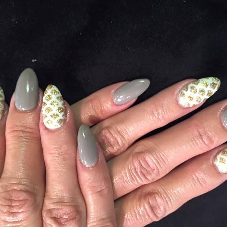 Sage and cream matte dip powder manicure with dotted detail, Oklahoma City nail salon
